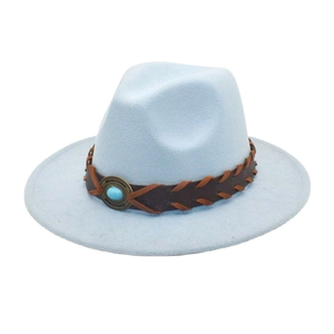 Detail of wool fedora hat featuring brown braided leather band and turquoise stone accent