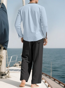 Men's linen beach set featuring a light blue long sleeve shirt and black loose trousers