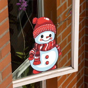 Close-up of snowman window sticker on glass with festive red and white holiday design