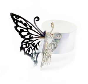 Macro shot of laser-cut butterfly napkin ring with intricate hollow texture