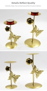 Macro detail of golden metal candle holders featuring butterfly and floral ornaments