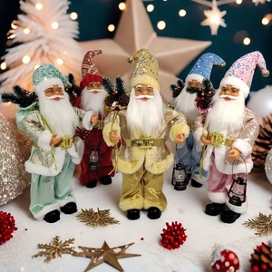 Detailed view of five colorful sequined Santa Claus figurines in a festive winter scene