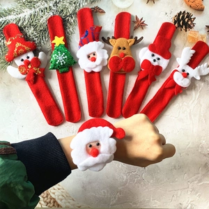 Christmas snap bracelet set featuring Santa and reindeer designs on marble surface