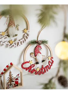 Detail of wooden Christmas gnome ornaments with red hats and fuzzy beards on string