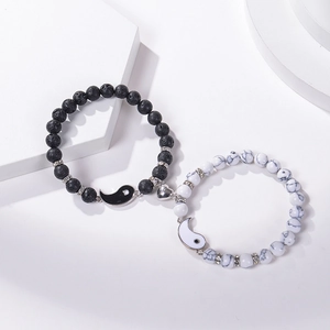 Yin Yang Tai Chi couple bracelets with magnetic heart and natural stone beads on a white base