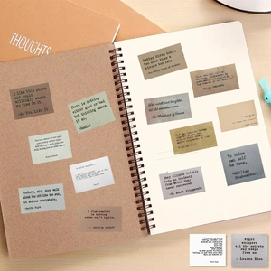 60 vintage inspirational quote stickers applied on a kraft notebook for DIY decoration