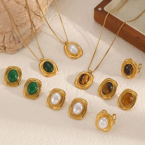 Vintage gold stainless steel jewelry set with natural green and white stones