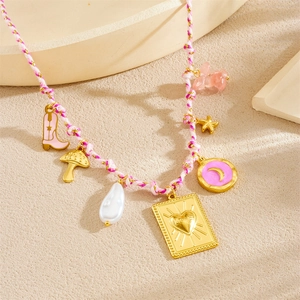 Detail of woven necklace featuring pink and gold charms with starfish and pearls