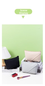 Three-piece dumpling-shaped makeup bags with elegant accordion pleated details on table
