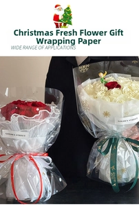 Detail of Christmas snowflake cellophane wrap on red and white flower bouquets