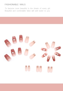 Detail of French blush gradient press-on nails with plaid patterns and pearl accents
