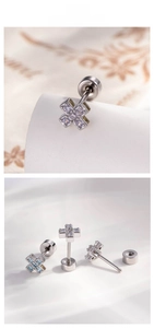 Detailed view of crisscross screw back earrings with colorful micro-inlaid zircons