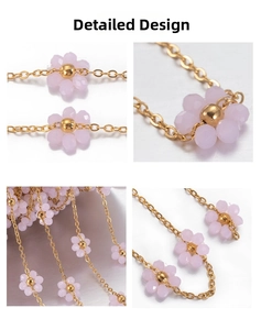 Macro shot of pink floral beads on a gold-plated stainless steel chain for jewelry making