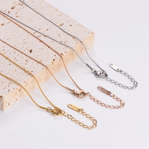 Three minimalist snake bone necklaces in silver, gold and rose gold finishes with 18KGP tags