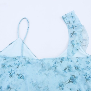 Detail of light blue floral mesh top with ruffle shoulder and thin adjustable strap