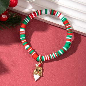 Detail of Christmas bracelet with Santa charm and red, white, green clay beads