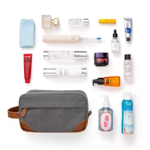 Large capacity canvas toiletry bag for men with grooming products layout