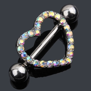 Macro detail of gunmetal heart nipple ring with iridescent colorful rhinestones