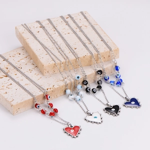 Set of four stainless steel heart necklaces with colorful evil eye beads in 4 colors
