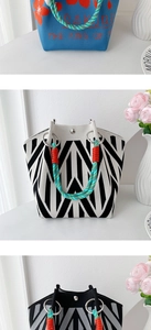 Close-up of knit handbags featuring colorful patterns and braided rope metal handles