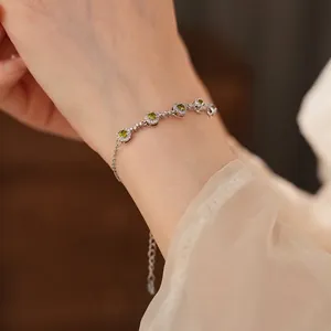 Elegant silver bracelet with five round green zircons and sparkling micro-pave crystals