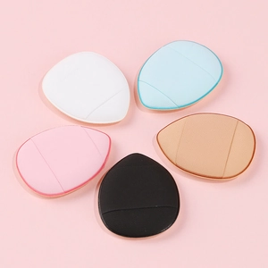 Set of five colorful mini teardrop finger puffs in blue pink black and white on pink background