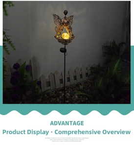 Solar angel garden stake light with warm glowing glass ball and bronze metal cutout detail