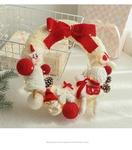 White Christmas wool felt wreath with red bow and LED lights for festive decor