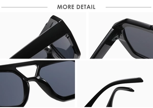 Detail of black sunglasses showing wide temples, sturdy hinges and double bridge design