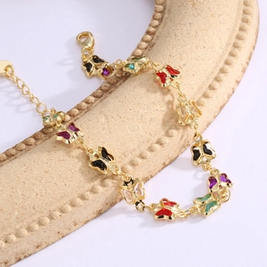 Gold-plated brass butterfly bracelet featuring colorful acrylic stones and lobster clasp