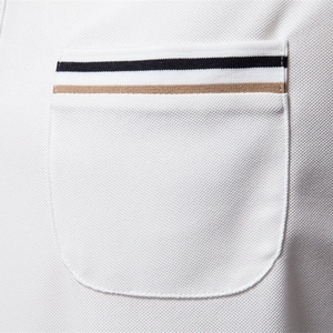 White men's piqué polo shirt featuring chest pocket with black and khaki stripes detail
