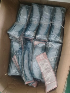 Detailed view of individual plastic packaging for cartoon bath toy mesh storage bags in a box
