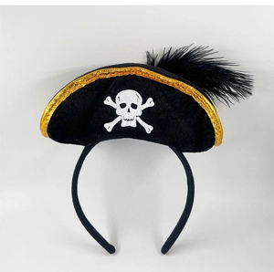 Detail view of a black velvet Halloween pirate headband with gold trim and feather