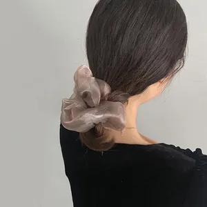 French style champagne organza scrunchie hair tie on brunette hair with soft silk texture