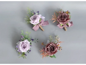 Detailed view of silk rose boutonnieres with purple ribbons and rustic twine handles
