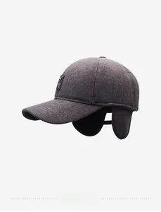 Side view of winter wool baseball cap featuring fold-down earflaps in charcoal grey