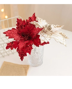 Detail of red and champagne gold poinsettias with sequins and gold stitching