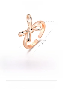 Detail showing S925 hallmark on a rose gold hollow bow open ring with dimensions