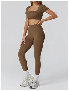 Detail of seamless ribbed high-waist yoga leggings and square neck crop top in brown