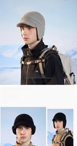Close-up of winter knit baseball hat with earflaps and warm fleece lining for outdoors