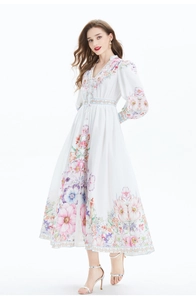 Detail of floral printed linen maxi dress with V-neckline and lantern sleeves