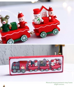 Detail of wooden Christmas train with hand-painted Santa, snowman figures and gift box