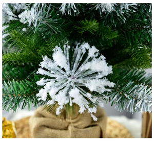 Detailed macro view of 60cm mini Christmas tree with snow-covered needles and burlap base