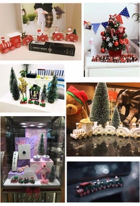 Detailed view of mini wooden Christmas train with snowman and Santa figures on a desk