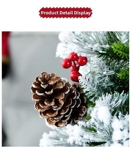 Close-up of 60cm Christmas tree with pine cones, red berries and artificial snow effect