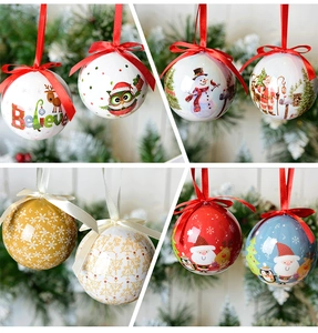 Close-up of assorted colorful painted Christmas balls with Santa and reindeer motifs