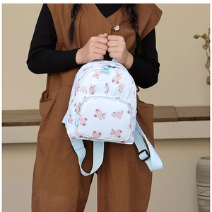 Detailed view of kids cartoon bear backpack with front zipper pocket and cute 3D ears
