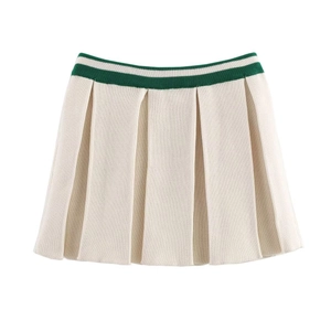 Detail of high-waisted pleated knit mini skirt with contrasting green striped waistband