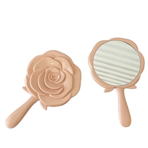 Pink rose shaped portable hand mirror for makeup, front and back view on white background
