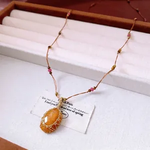 Handcrafted woven yellow gemstone pendant necklace with retro mesh design for women